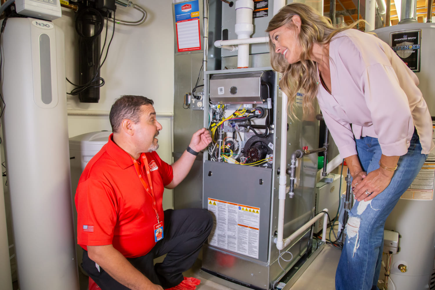 Perfect Home Service technician explaining HVAC issue